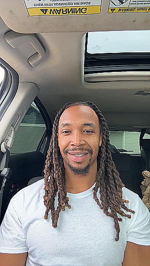 Profile photo for Que Scott